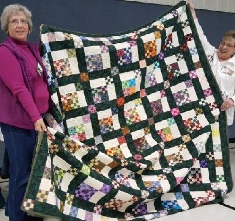 Rene shows her Nine patch, group exchange project. Every quilt turned out very different.